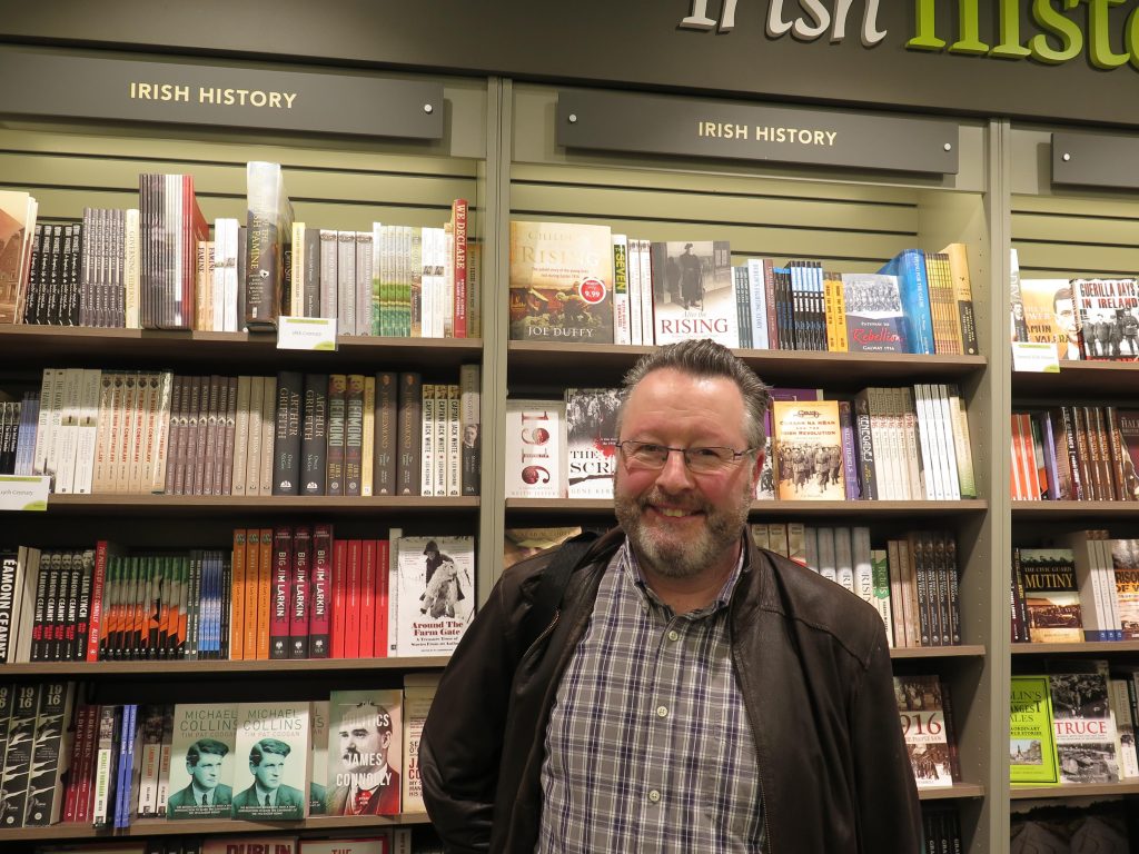 Paul Gorry in a book shop smiling