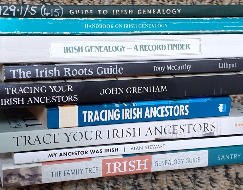Stack of genealogy books for researching your family tree