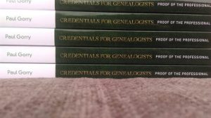 A stack of credentials for genealogists book spine