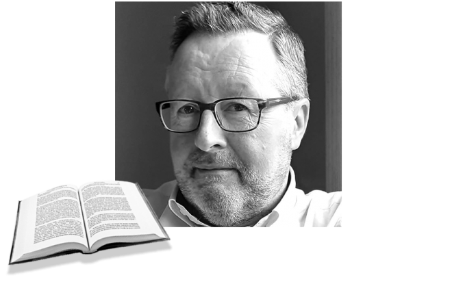 Paul-MainHome Paul headshot in black and white with open book